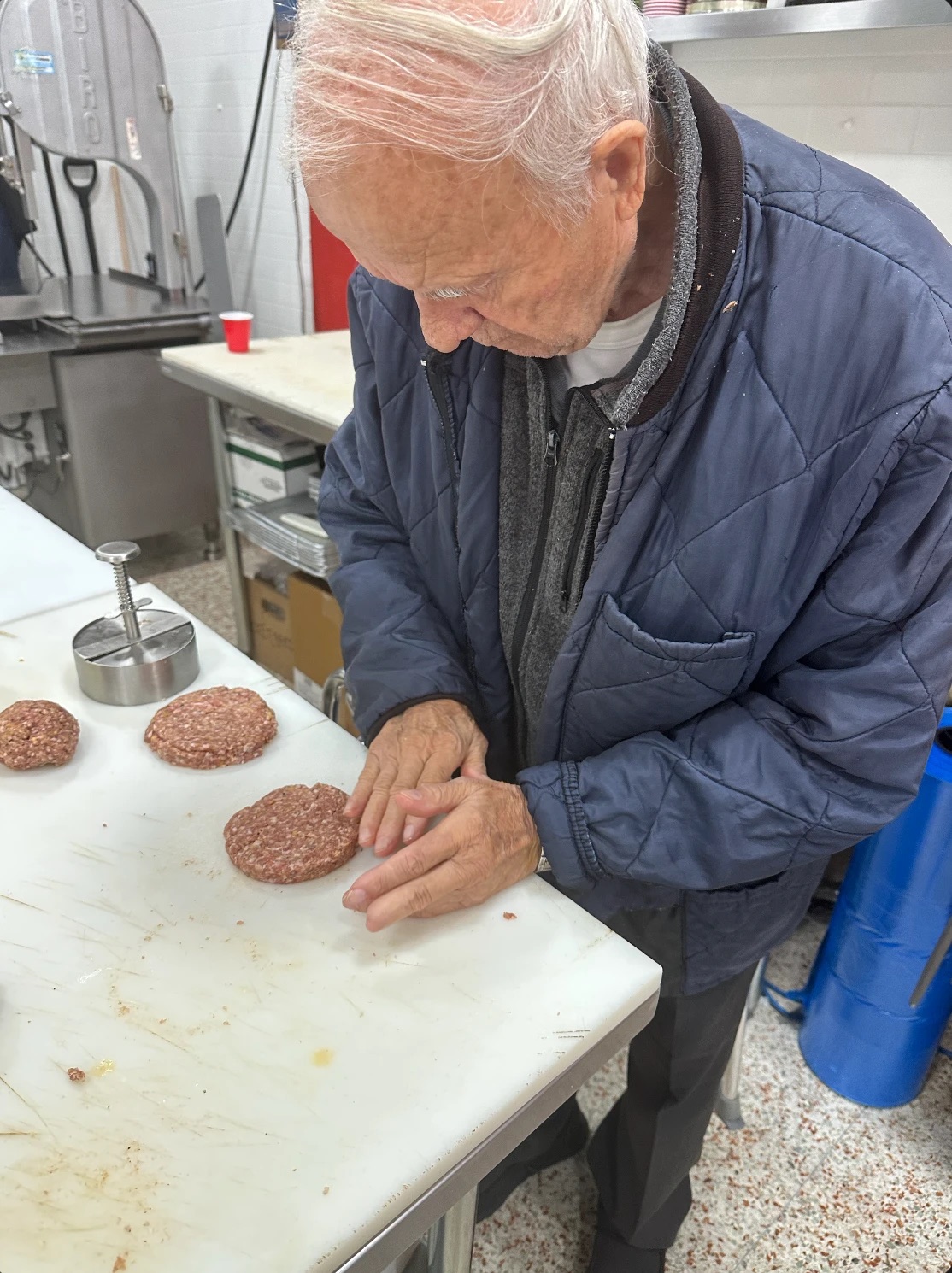 Shaping burger patties by hand at the block