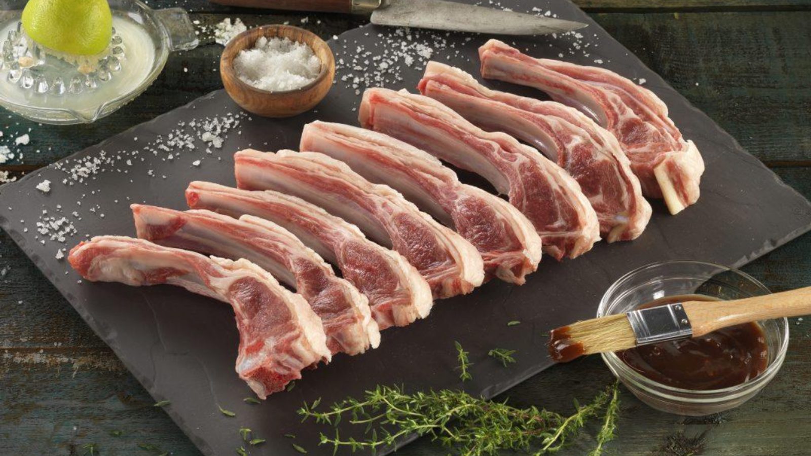 Raw Quebec lamb chops arranged on slate