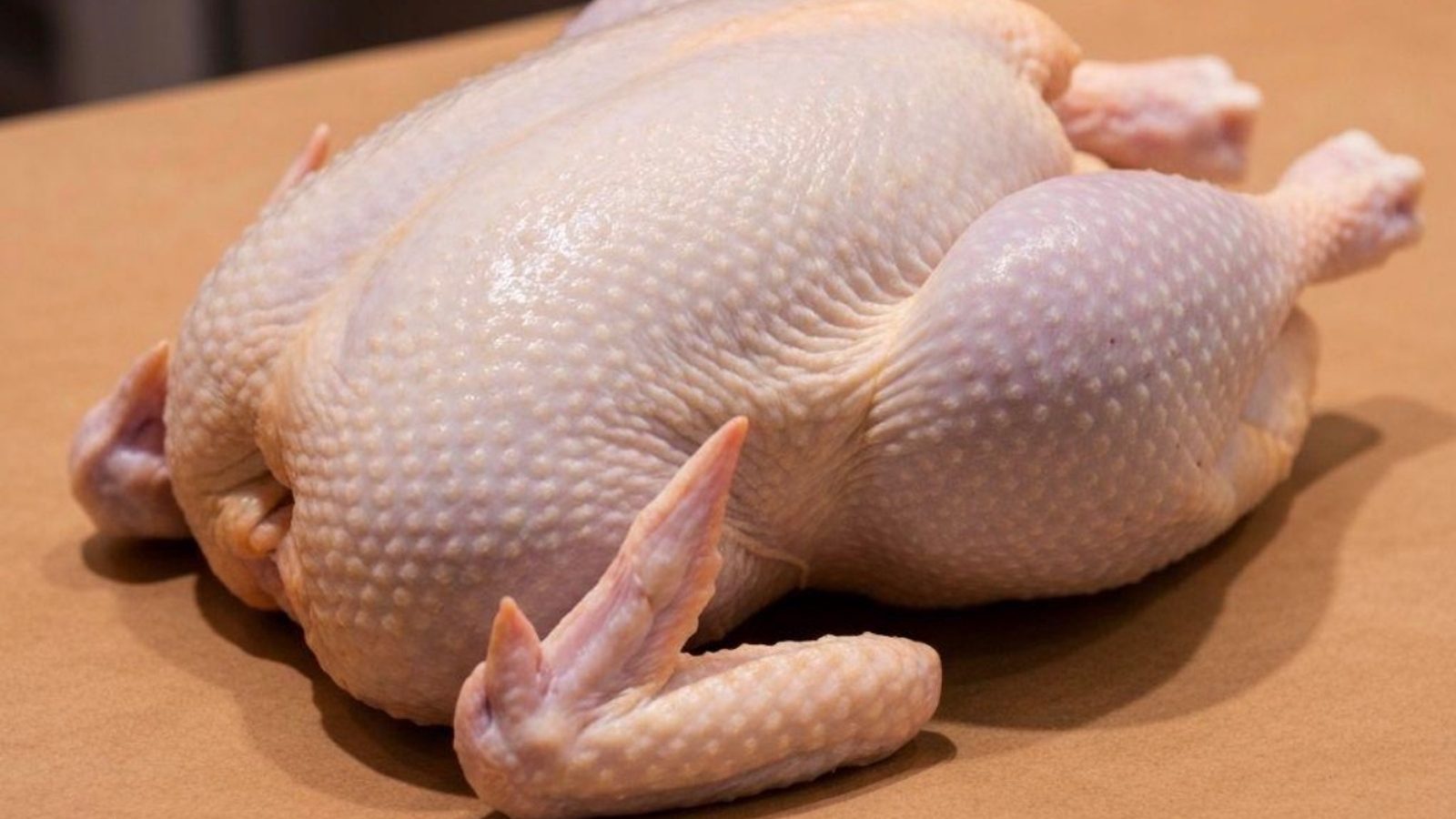 Whole raw chicken ready for the barbecue